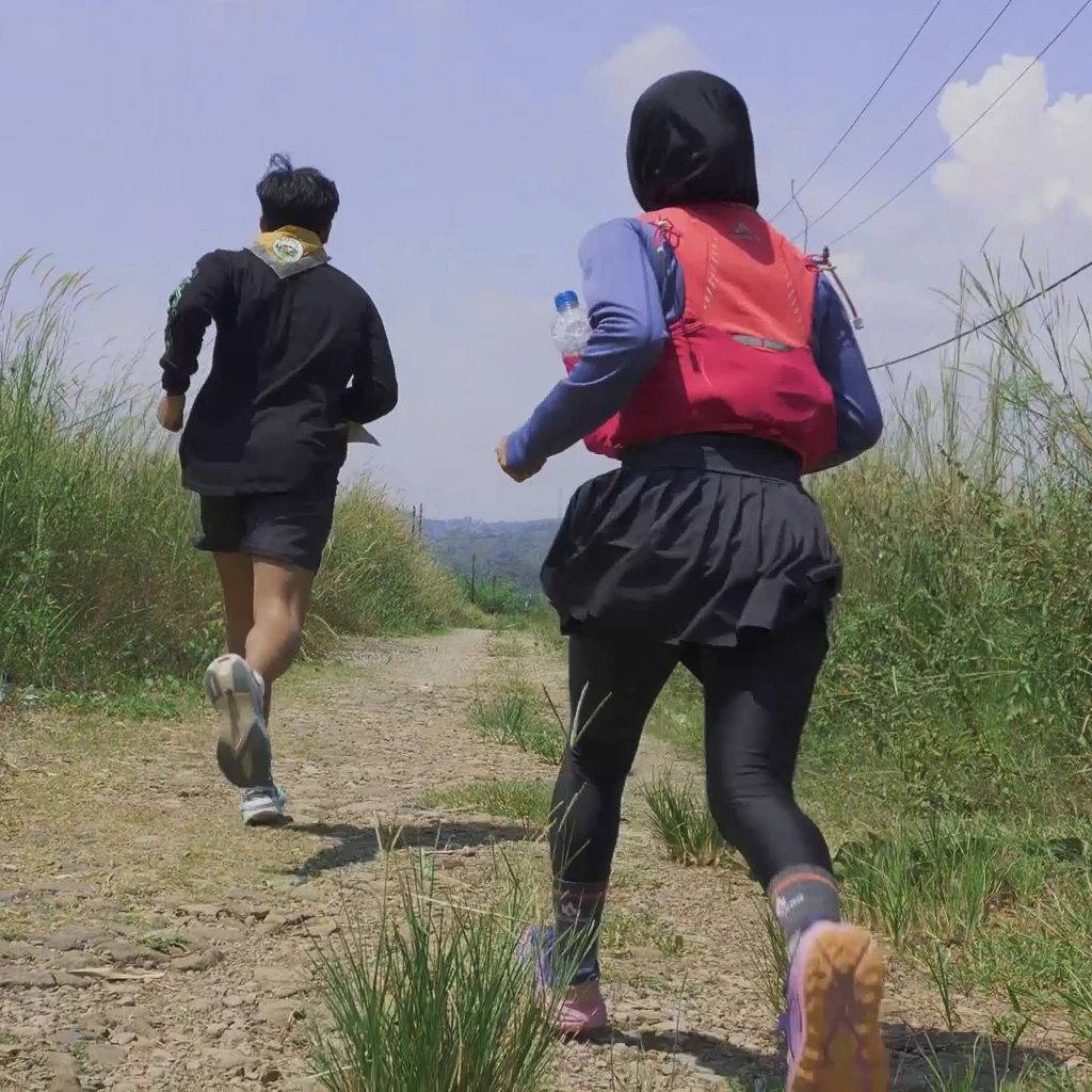 Trail runners on course through the e